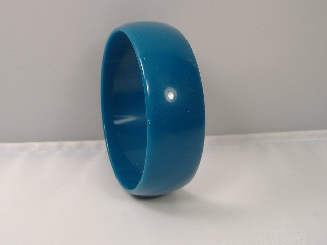 Vintage Lucite Bangle Bracelet: Vintage Lucite Bangle Bracelet. Manufactured by Best Plastics of Providence RI in the 1970s. Measures approx. 2 3/4 inches at it's maximum width