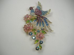 Ann Primrose Crystalleria Designer Pin/Brooch: From the Ann Primrose Collection comes this opportunity to own a masterpiece! Chunky, Attention grabbing, and sleek, this pin will be the talk of any gathering! The angular crystals glare as light hit