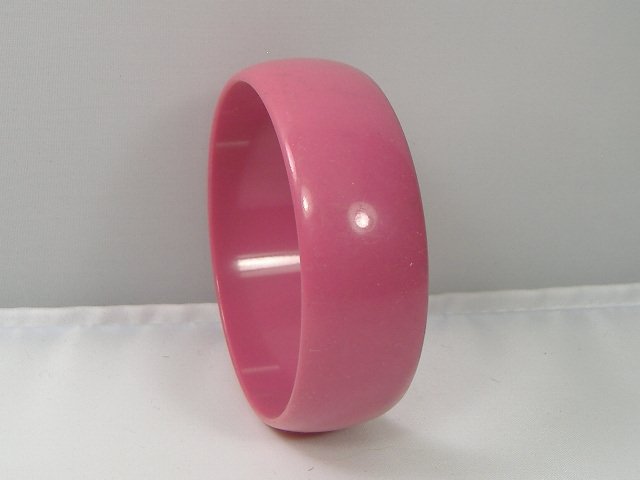 Vintage Lucite Bangle Bracelet: Vintage Lucite Bangle Bracelet. Manufactured by Best Plastics of Providence RI in the 1970s. Measures approx. 2 3/4 inches at it's maximum width