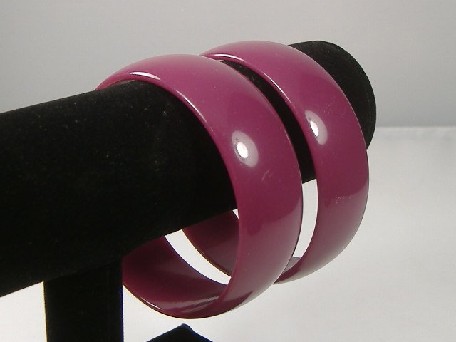 Set of 2 Vintage Lucite Bangle Bracelets: 2 Vintage Lucite Bangle Bracelets. Manufactured by Best Plastics of Providence RI in the 1970s. Measures approx. 2 3/4 inches at their maximum width
