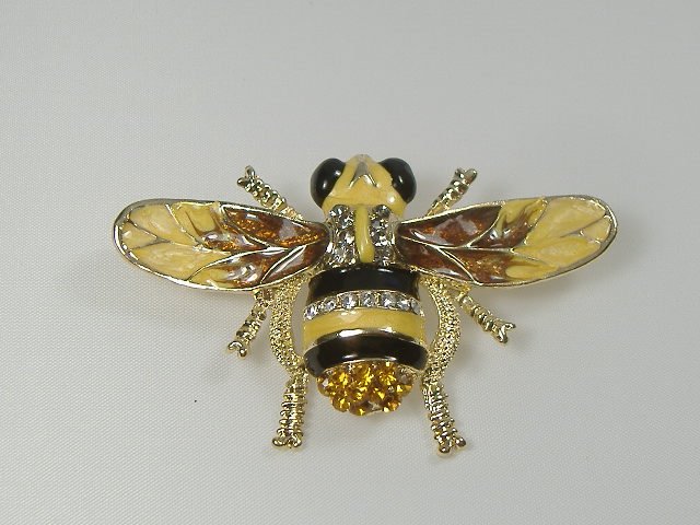 Crystalleria Designer Pin/Brooch: From the Ann Primrose Collection comes this opportunity to own a masterpiece! Chunky, Attention grabbing, and sleek, this pin will be the talk of any gathering! The angular crystals glare as light hit