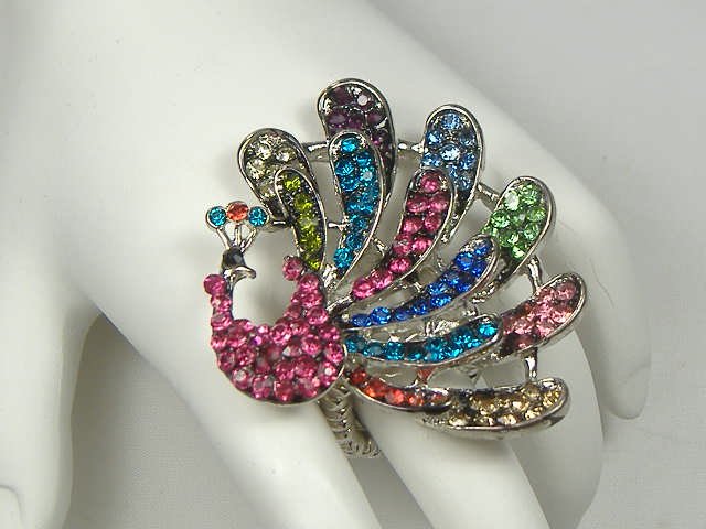 Crystalleria Peacock Stretch Ring: Will stretch to comfortably fit any size finger.