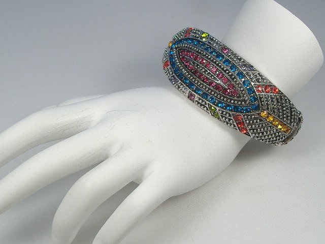 Swarovski Crystal Element Bangle Bracelet: This bangle bracelet is a hinged design and will open to fit any size wrist. Gorgeous, bright Austrian Crystals in this piece