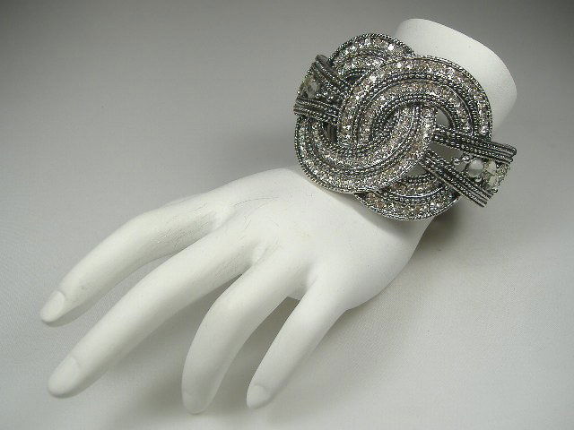 Swarovski Crystal Element Bangle Bracelet: This bangle bracelet is a hinged design and will open to fit any size wrist. Gorgeous, bright Austrian Crystals in this piece