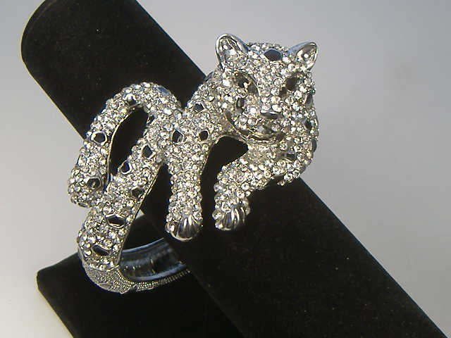 Swarovski Crystal Element Tiger Bangle Bracelet: This bangle bracelet is a hinged design and will open to fit any size wrist. Gorgeous, bright Austrian Crystals in this piece