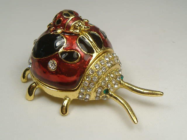 Crystalleria Ladybug Jewelry Box: This jewelry box measures approx. 2 1/2 inches in length, 1 3/4 inches at it's maximum width, and approx. 1 inch in height. The inside jewelry box is a little smaller than these dimensions.