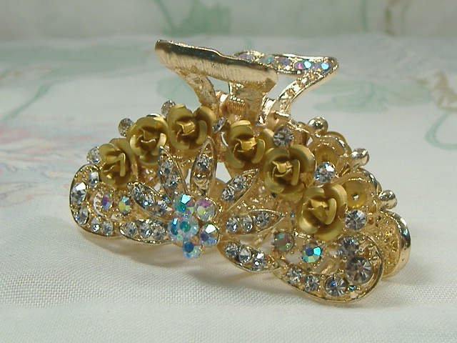 Swarovski Crystal Element Hair Clip: Chunky, attention grabbing, and sleek, this hair clip will be the talk of any gathering! The angular crystals glare as light hits their surface at different angles. Caste in molten metal, formed, high