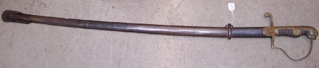 *NAZI SWORD: Having lion face handle, cross guard decorated with swastika and eagle, mark on blade reads "ION.NG 62 OSNE H.G62".