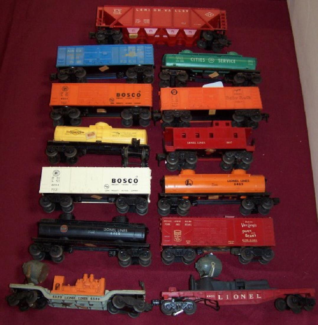 *16 PIECES OF LIONEL POST-WAR: Rolling stock, including searchlight cars, boom car, etc.