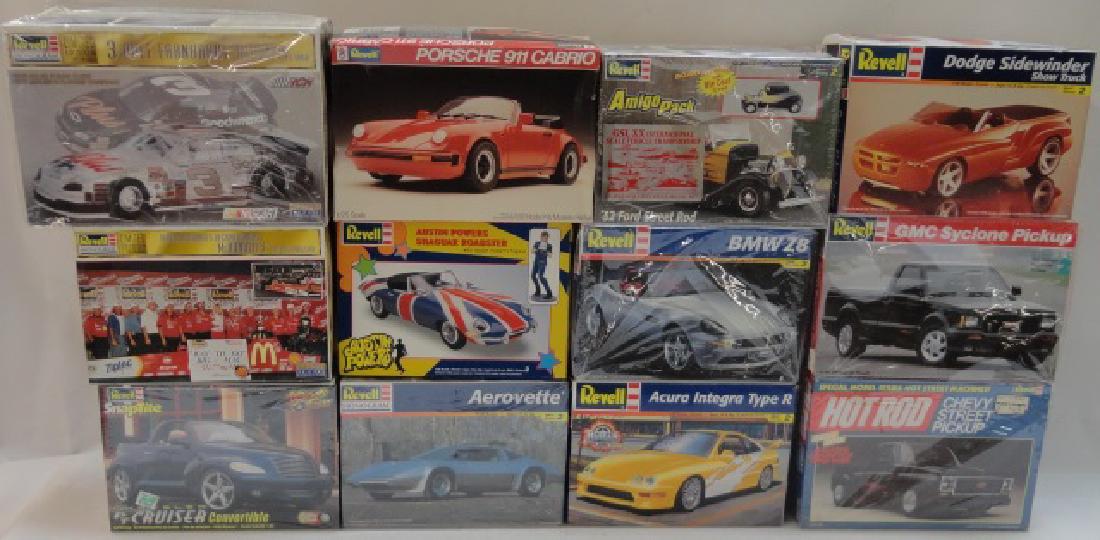 *12 REVELL PLASTIC MODEL CAR KITS: GMC Cyclone pick up, BMW Z8, Aerovette, Austin Powers Shaguar roadster, '32 Ford Street Rod, etc., in original boxes.