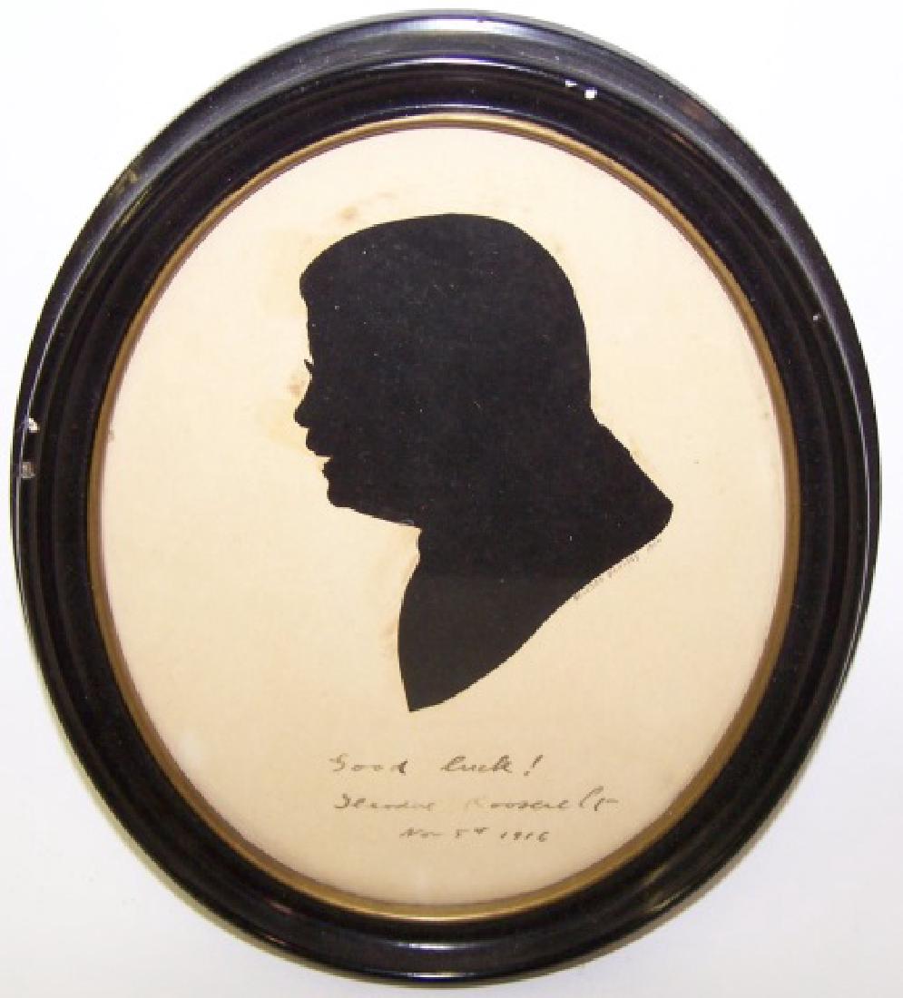 *SILHOUETTE OF THEODORE ROOSEVELT: Signed "Good luck! Theodore Roosevelt, November 5, 1916", enclosed in ebony frame, approximately 8 3/4" x 7".