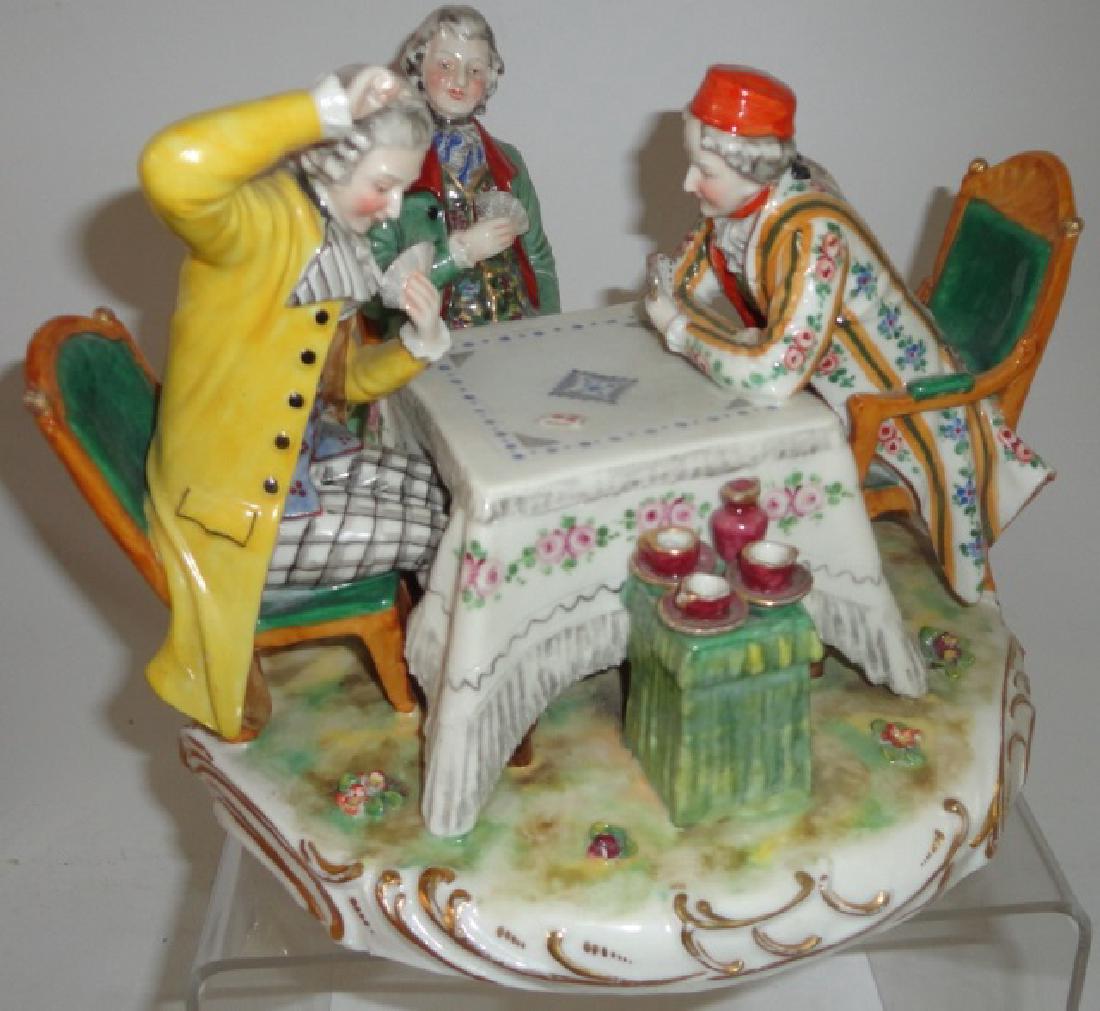 *CONTINENTAL PORCELAIN FIGURAL GROUPING: Gentlemen playing cards at game table, approximate height 7".
