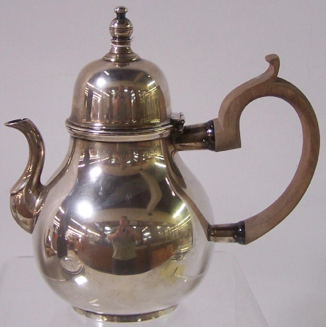 *GORHAM STERLING SILVER COFFEE POT: With wood handle, engraved on underside "Metropolitan Museum Reproduction, John Coney, Boston, about 1710", approximate height 8 1/2", approximate weight 17.44 troy ounces.