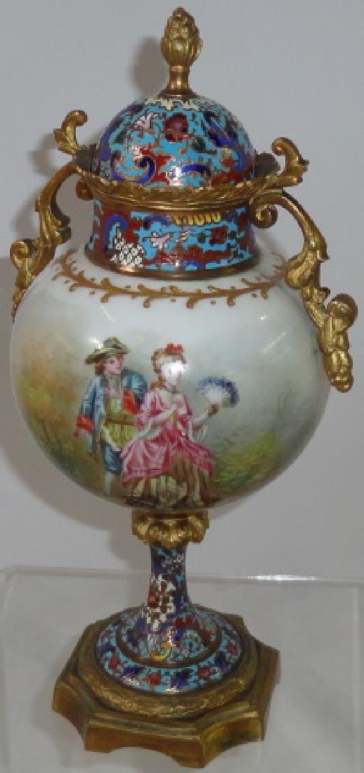 CONTINENTAL PORCELAIN COVERED URN: With champleve lid and brass clad base, decorated with 18th C. figures, artist signed, approximate height 10 1/4".