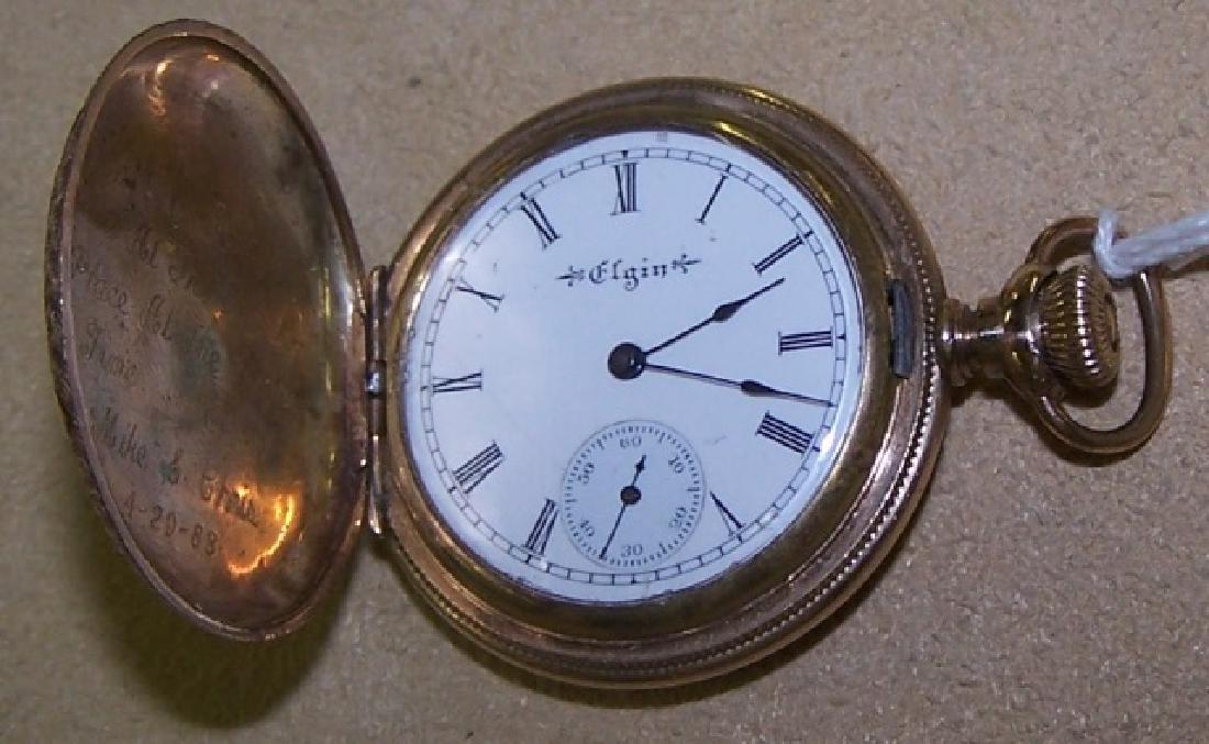 ELGIN NATIONAL WATCH CO. POCKET WATCH: Size OS, grade 222, fitted with 7 jewel movement, enclosed in 10K gold case, with diamond monogram "LE".