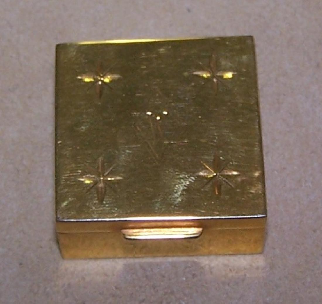*14K GOLD PILL BOX: Having hinged top and star decoration, approximate weight 16.9 dwt.
