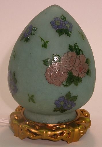 ***HANDEL ART GLASS NIGHT LIGHT| Fitted with a gr: ***HANDEL ART GLASS NIGHT LIGHT| Fitted with a green oviform shade having iced finish and painted on the exterior with stylized floral and leaf decoration, signed Handel and numbered 7093, shade heigh