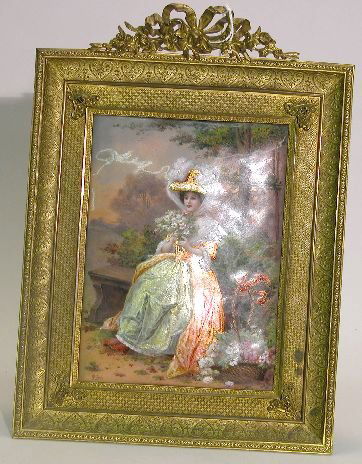 ***LIMOGES ENAMEL ON COPPER PLAQUE| Having handpa: ***LIMOGES ENAMEL ON COPPER PLAQUE| Having handpainted scene depicting a woman in Victorian dress sitting on garden bench with bouquet of flowers, artist signed lower left HJC Jean and mounted in gilt