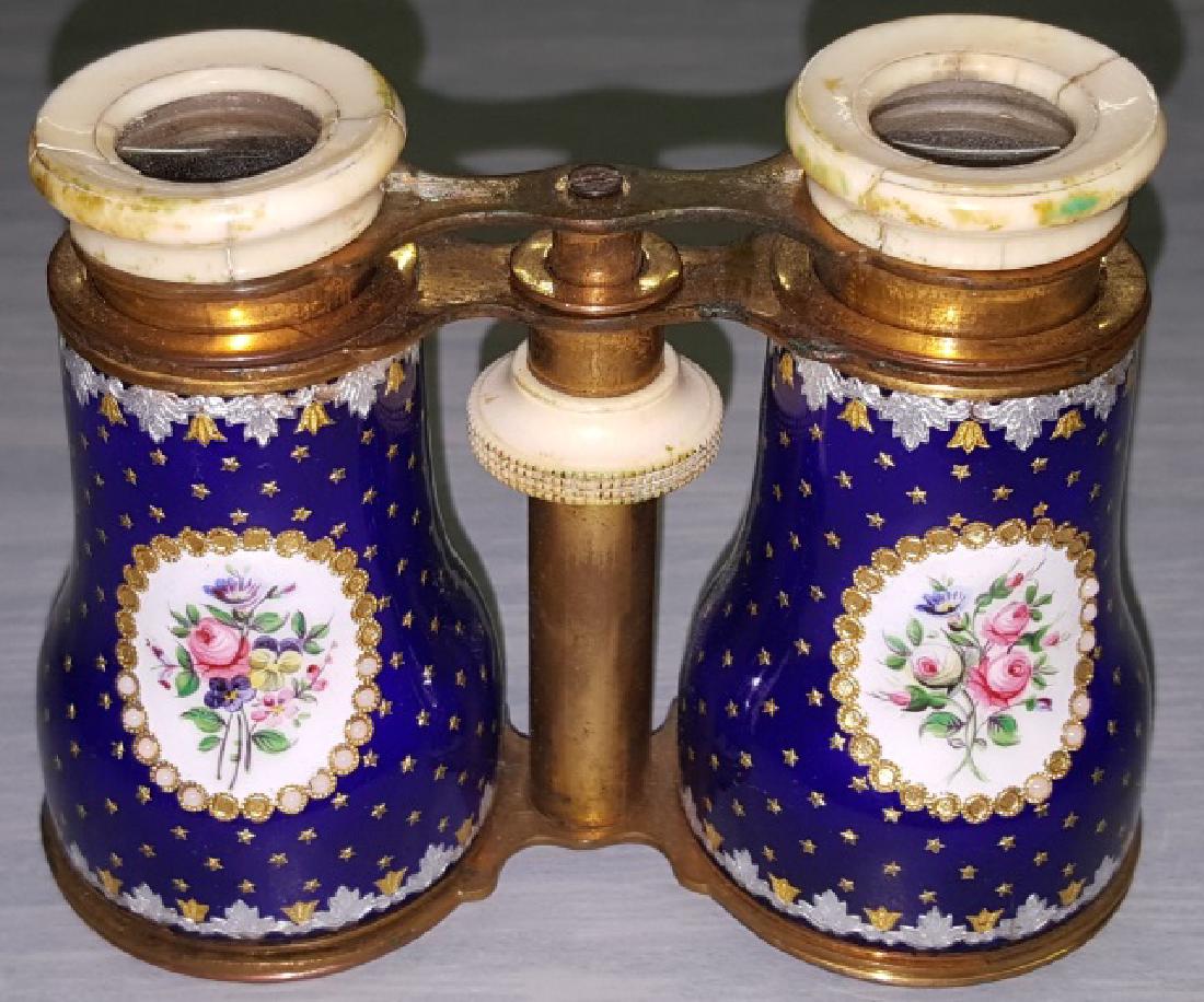 *PAIR OF ENAMEL, BRASS, AND BONE OPERA GLASSES: Enamel body with cobalt blue ground having gilt and silver floral and star decoration.