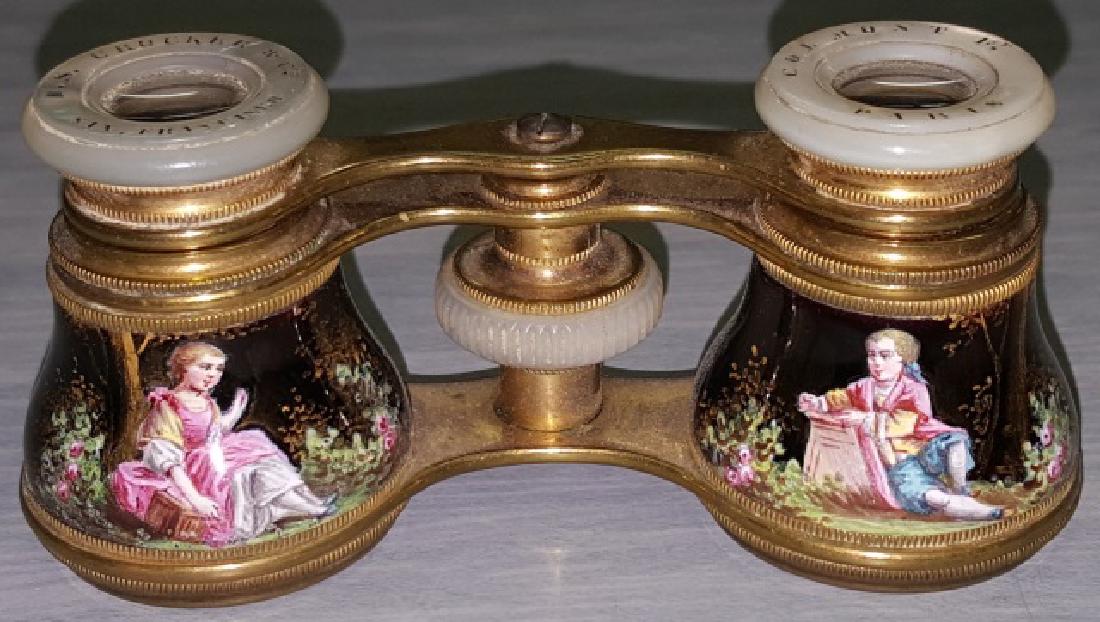 *PAIR OF ENAMEL AND BRASS OPERA GLASSES: Enamel decorated with flowers and garden scenes with figures, mother-of-pearl eye cups marked "Colmont Ft Paris, H.S. Crocker & Co., San Francisco".