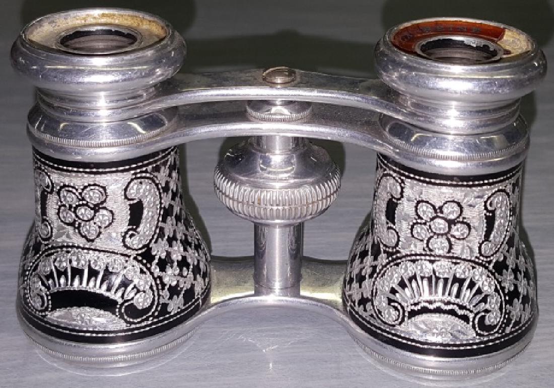*PAIR OF ALUMINUM OPERA GLASSES: Aluminum with etched decoration over black ground, marked "Lareine".