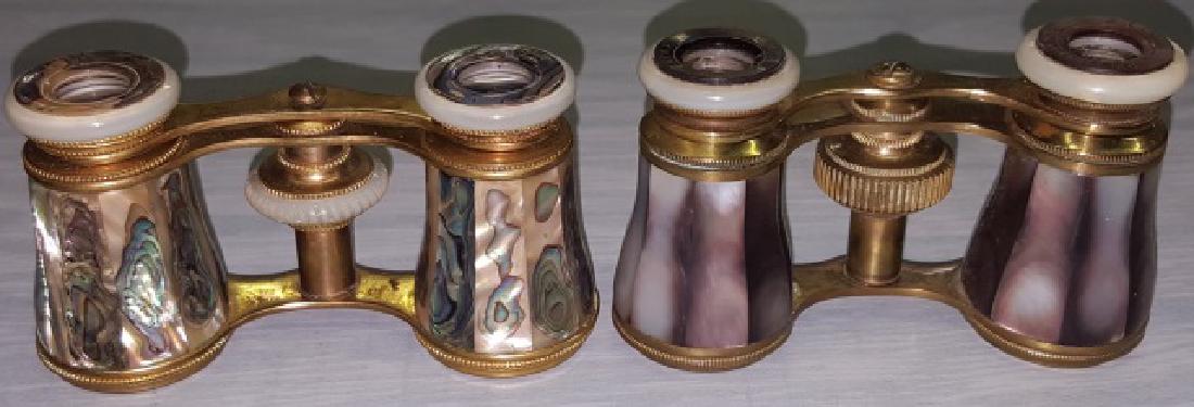 *2 PAIR OF MOTHER-OF-PEARL OPERA GLASSES: 1 pair gray mother-of-pearl and brass having eye cups reading "LeClaire Paris", 1 pair green mother-of-pearl and brass, mother-of-pearl on body and stems, stem marked "Chaussee D'Antin".