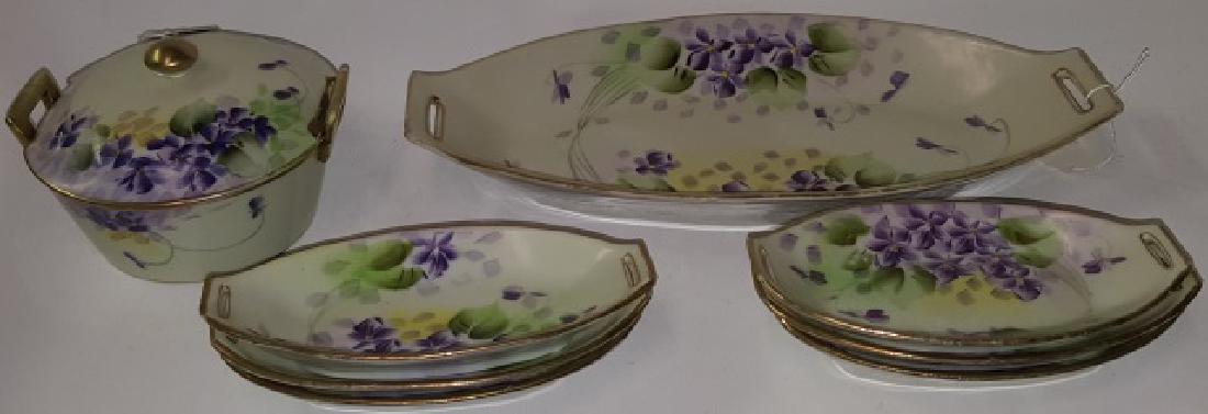 *9 PIECES OF NIPPON PORCELAIN: Bread tray, approximate length 13", 6 individual bread trays, and covered butter with insert, all with matching pattern.
