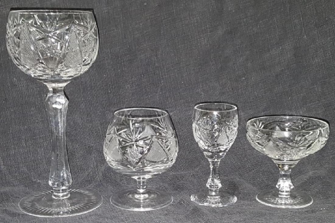 *GROUP OF CUT GLASS STEMWARE: 14 wine glasses, approximate height 6 3/4", 12 champagnes, height 3", 10 brandy snifters, height 3 1/2", and 6 sherrys, height 3 1/2".