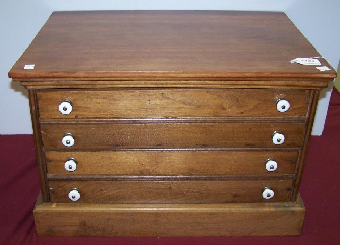 *SPOOL CABINET: Fitted with 4 doors and having porcelain pulls.