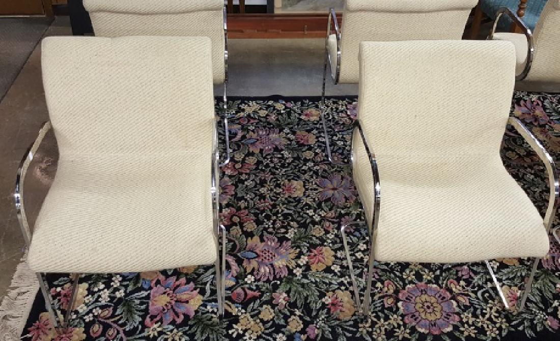 *SET OF GHIA ARMCHAIRS: By Charles Gibilterra for Brueton Industries, having light yellow upholstery and chrome frames.