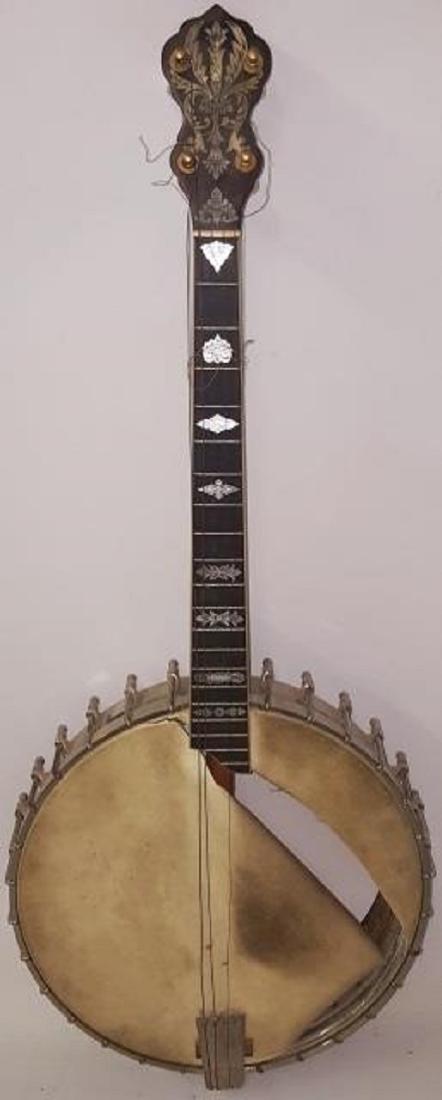 *VEGA 4-STRING BANJO: By the Vega Company, marked "Fairbanks banjo made by the Vega company, Boston Mass. style x no. 9", having inlaid mother-of-pearl decoration, numbered 51972, complete with skin and case.