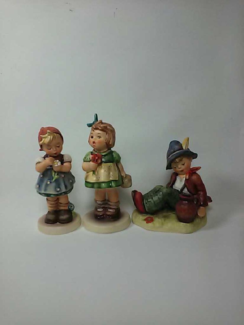 *3 HUMMEL FIGURES: "The Surprise" #431, "Coffee Break" #409, and "Daisies Don't Tell" #380.