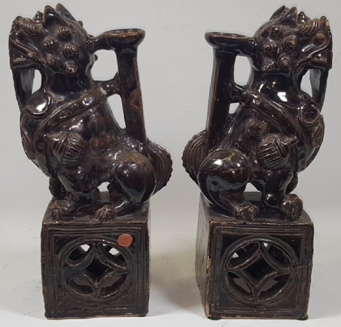 *PAIR OF CHINESE PORCELAIN SCULPTURES: Seated Foo dogs on blocks with handles, approximate height 13".
