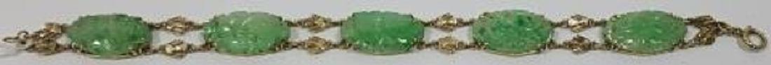 14K YELLOW GOLD & JADEITE BRACELET: Set with 5 carved green jade stones in 14K yellow gold mount, approximate bracelet length 6 3/4", approximate weight 9.5 dwt.
