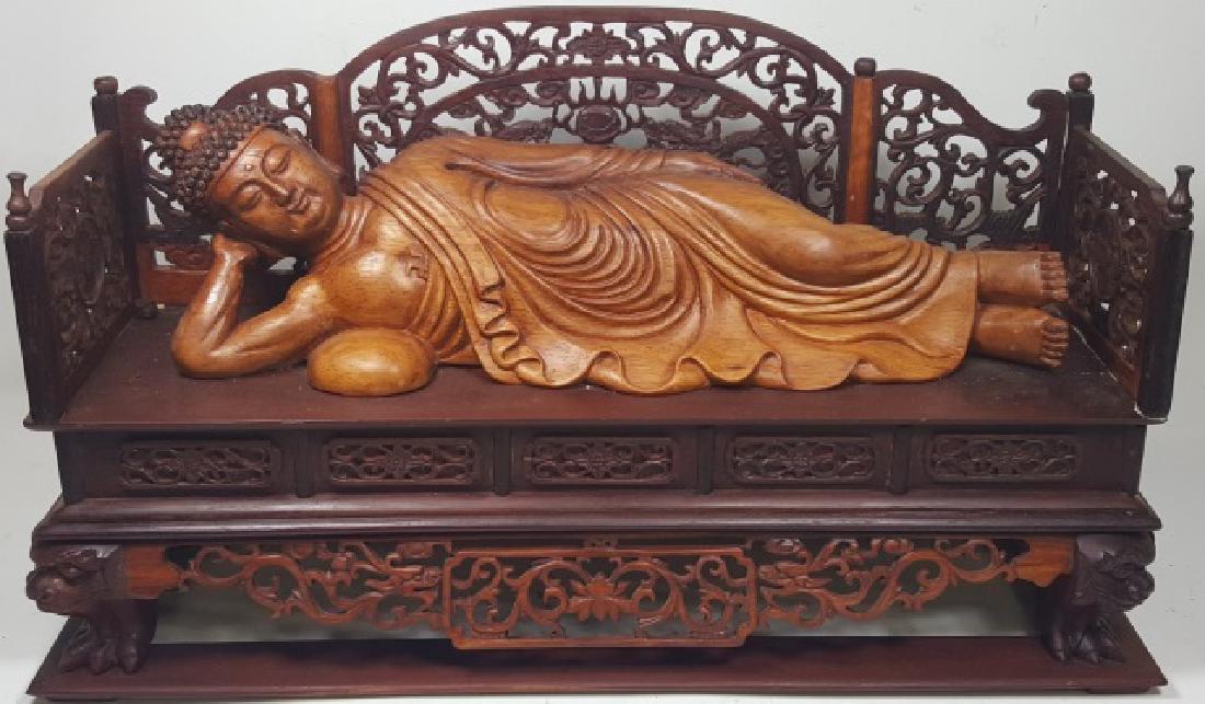 *CHINESE CARVED WOOD SCULPTURE: Reclining figure in daybed, approximate height 11", length 19".