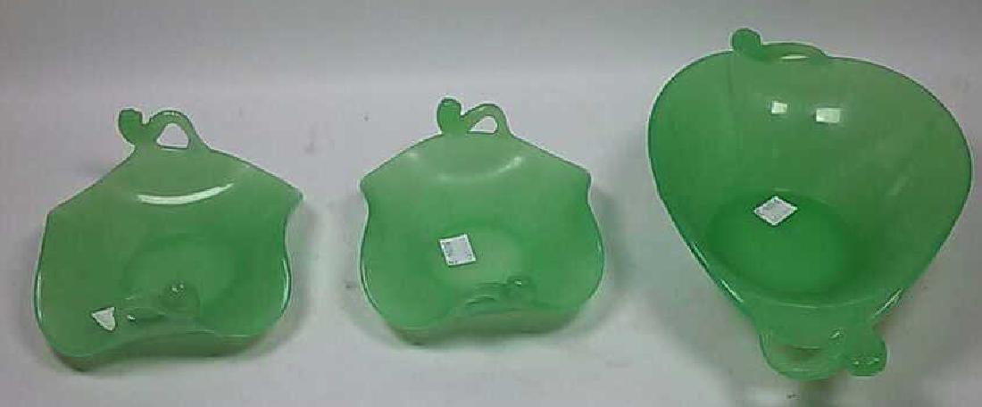 *3 PIECES OF JADEITE GLASS: 2 trays and 1 oval bowl, all having dolphin form handles, approximate width 6 1/2" and 10 1/2".