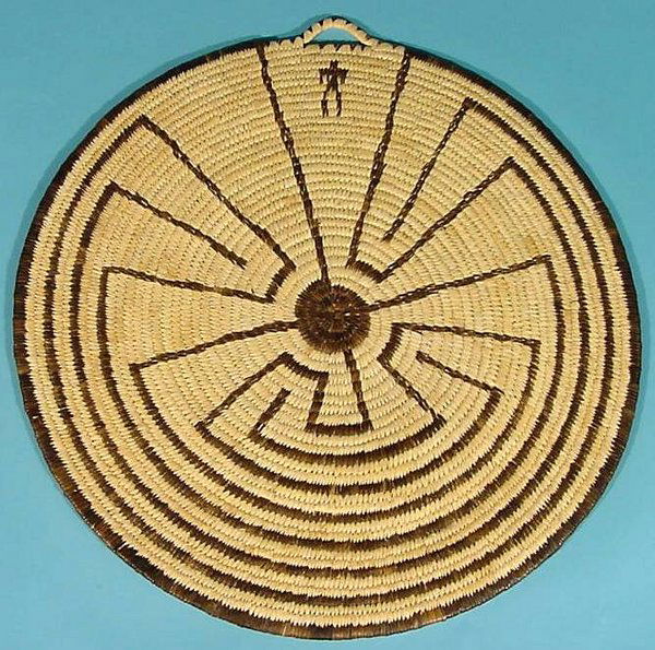 PAPAGO COIL BASKET| Bundle foundation with ''Man: PAPAGO COIL BASKET| Bundle foundation with ''Man in the Maze'' plaque shaped basket, approximate diameter 21''. CONDITION: Good.