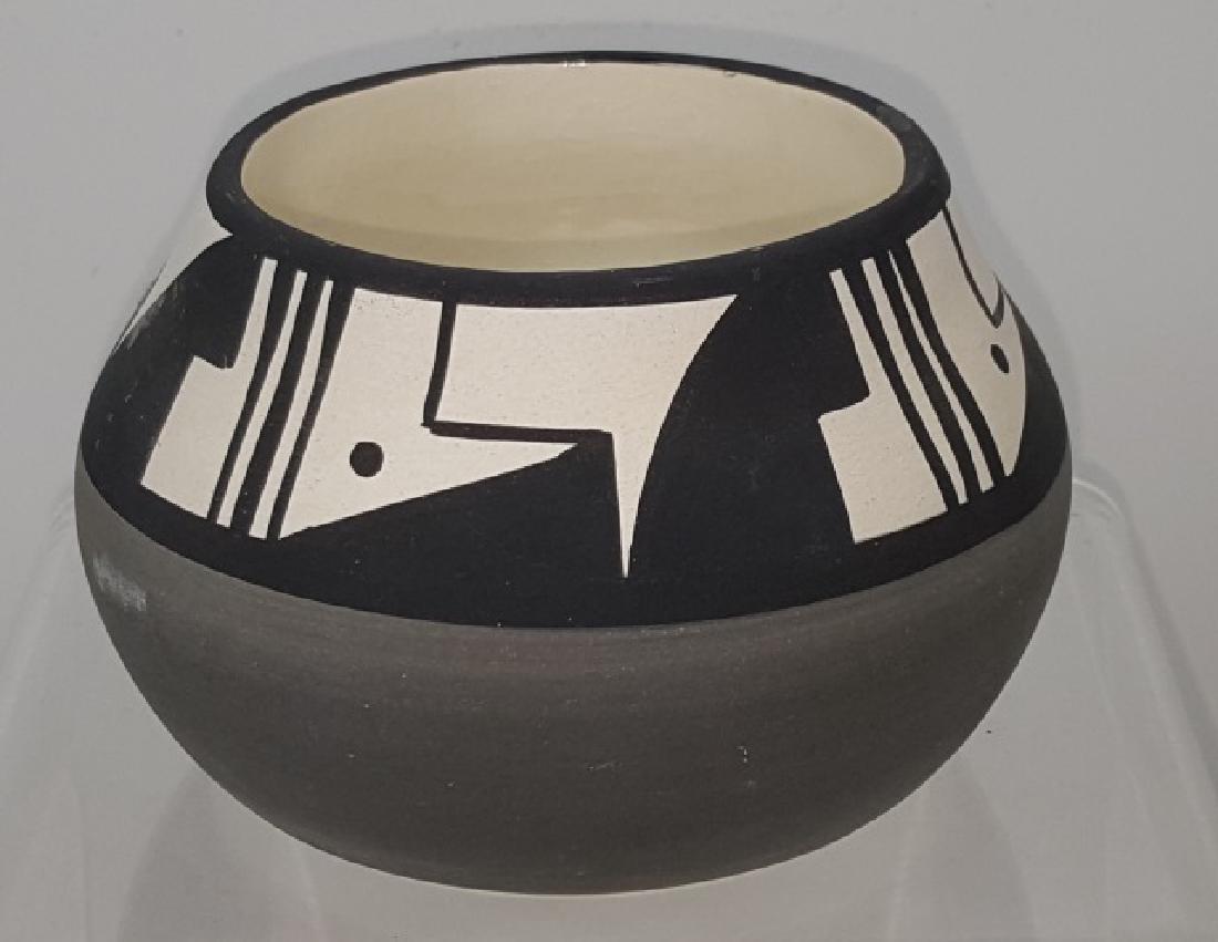 *RUTH ROOT POTTERY JAR: With geometric design, signed on bottom "10 Ute (Ute Mountain Pottery), Ruth", approximate height 2 1/8", diameter 4 1/8".
