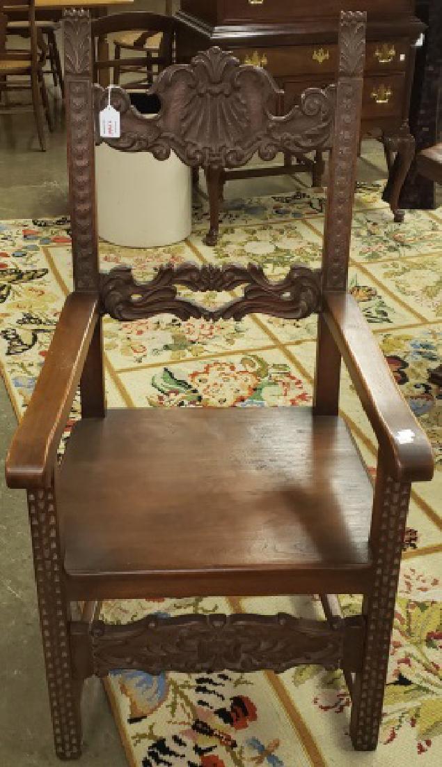*SPANISH STYLE ARMCHAIR: By Joseph F. Milbeck, Designer and Manufacturer, Reproduction of Antiques, having heavily carved frame decorated with shell and scroll work, approximate height 47", width 24", depth 24".