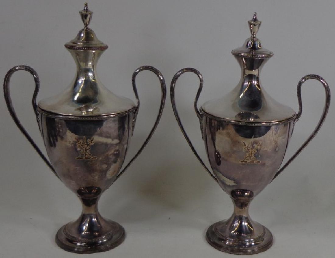 *PAIR OF LATE 18TH C. SHEFFIELD COVERED URNS: With engraved weapons trophy, approximate height 12".