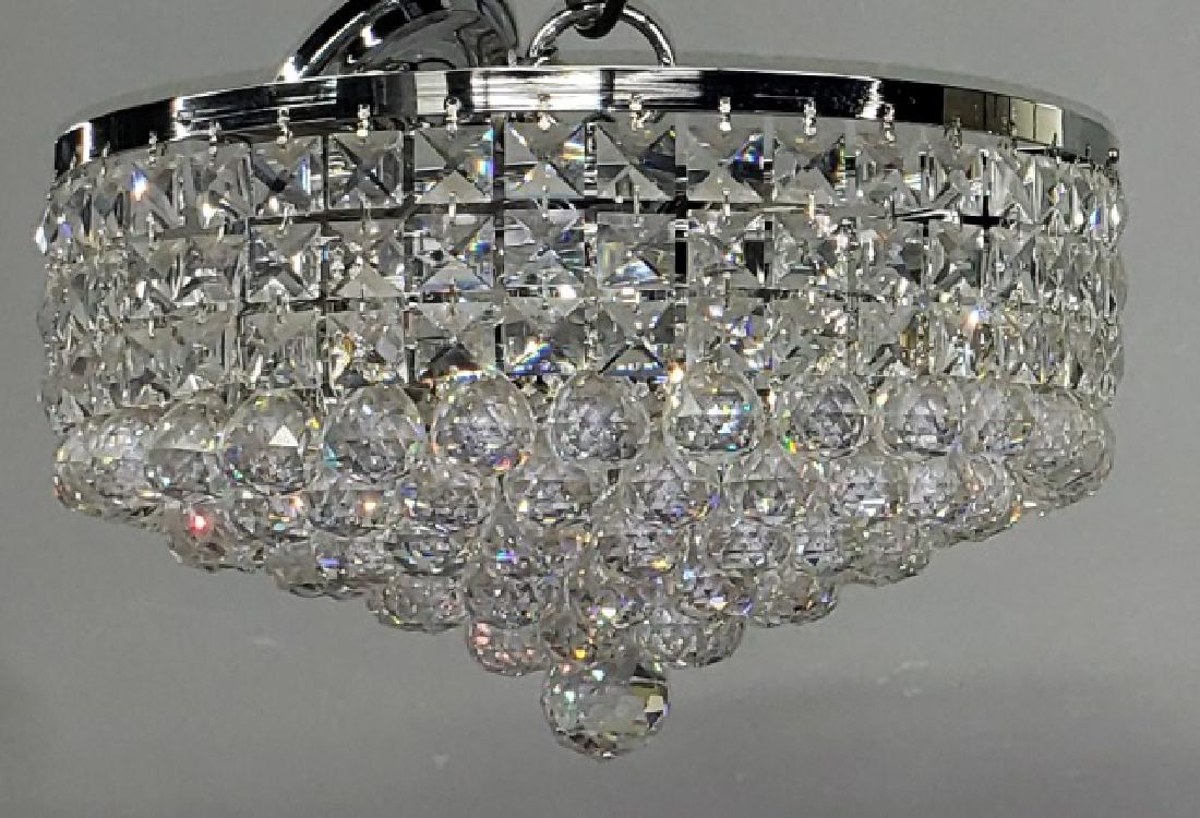 *CONTEMPORARY CEILING FIXTURE: With circular form, decorated with glass pendants.