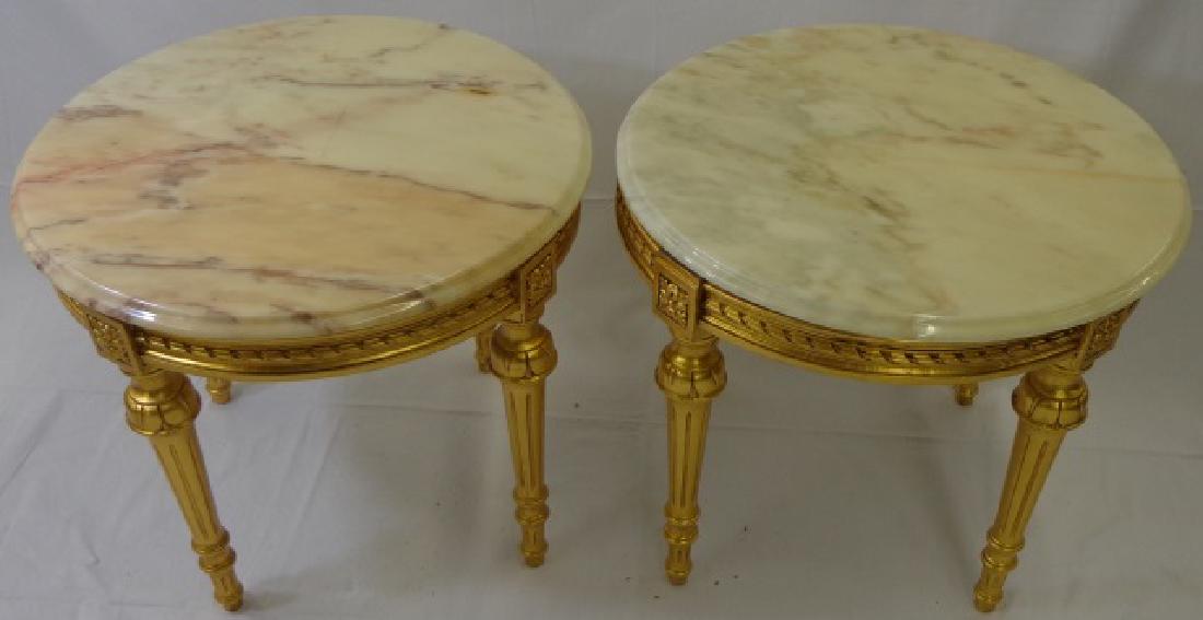 *PAIR OF ITALIAN STYLE SIDE TABLES: Having circular marble top raised on conforming base with circular tapering legs and gilt finish, approximate height 20", diameter 23".