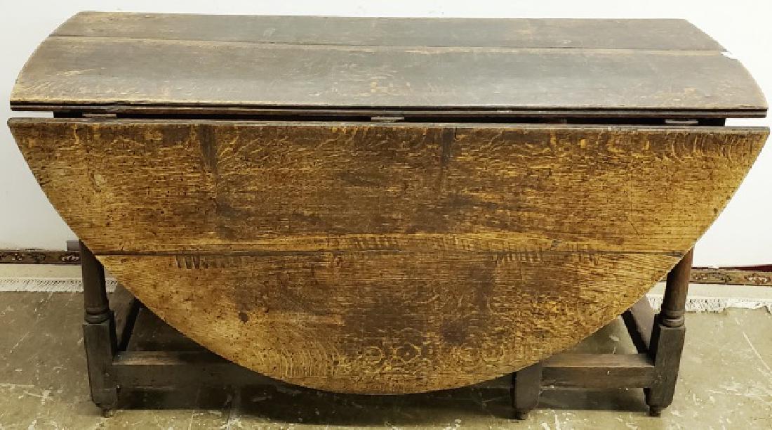 *18TH C. ENGLISH DROP LEAF TABLE: Approximate height 29", width 54 1/2", depth 21" closed, 64 3/4" open.