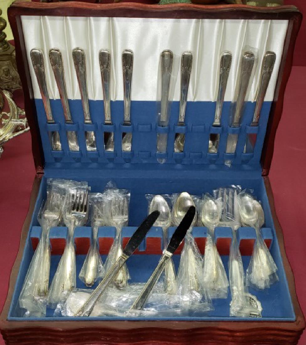 *SET OF ROGERS BROS. SILVERPLATE FLATWARE: With case.