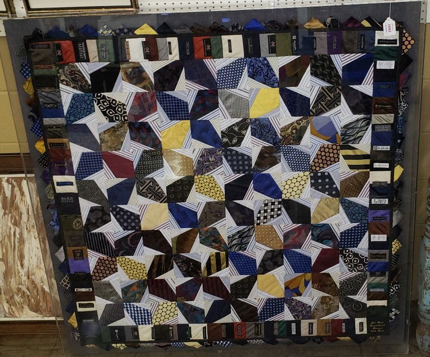 *TEXTILE COLLAGE: Shirts and ties housed in plexiglas frame, from designers Versace, Ricci, Calvin Klein, Zanzara, etc., "Ted Ross remembered forever, with love" stitched in lower right, approximate frame size 51 1/2"