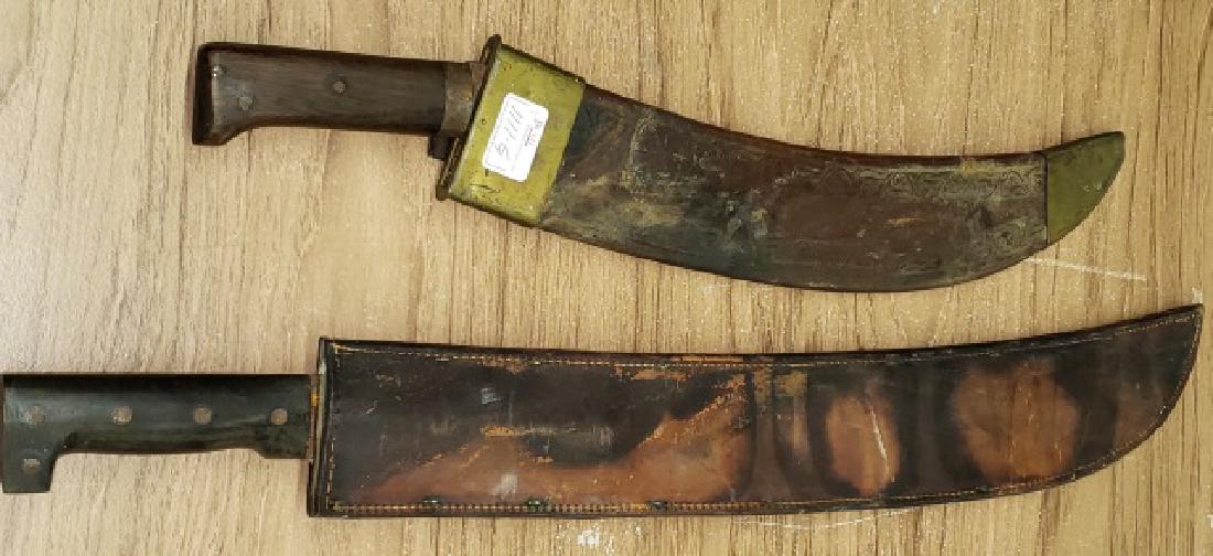 2 MACHETES: Both with leather sheaths, approximate length of longest 27 1/4".