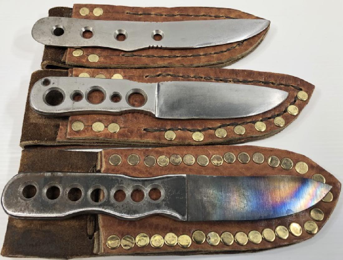 *3 THROWING KNIVES: All with leather sheaths.