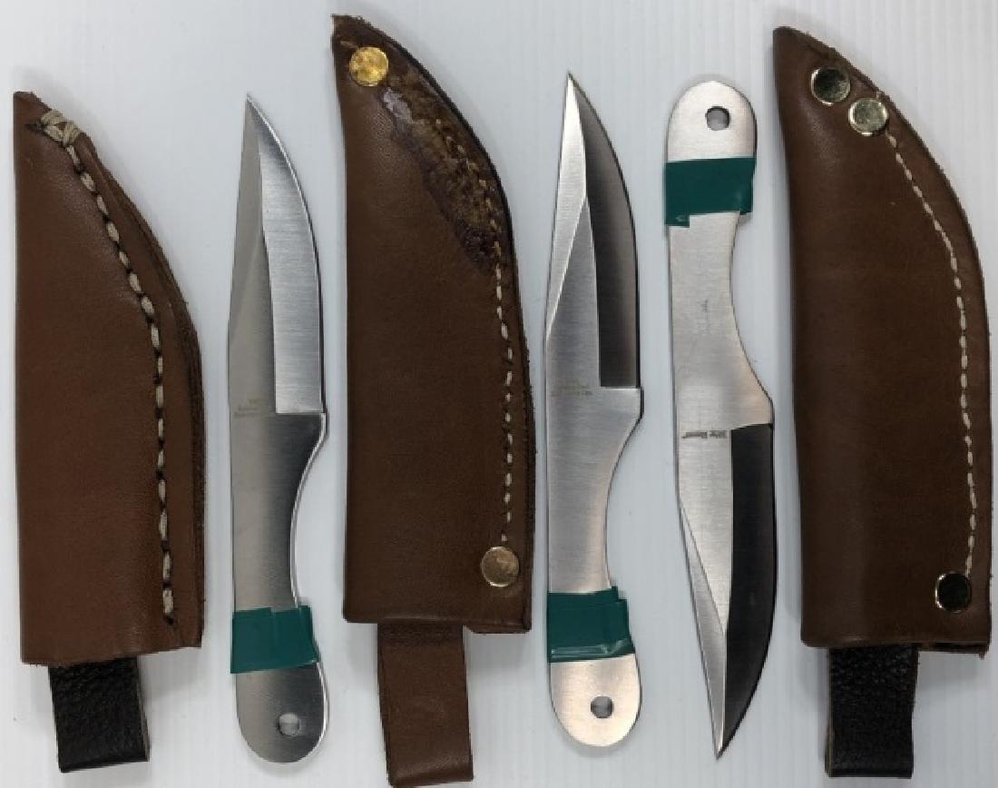 *3 THROWING KNIVES: All marked "Ridge Runner", with leather sheaths.