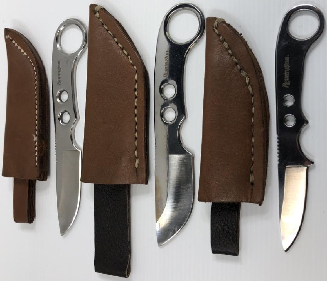 *3 REMINGTON THROWING KNIVES: All with leather sheaths.