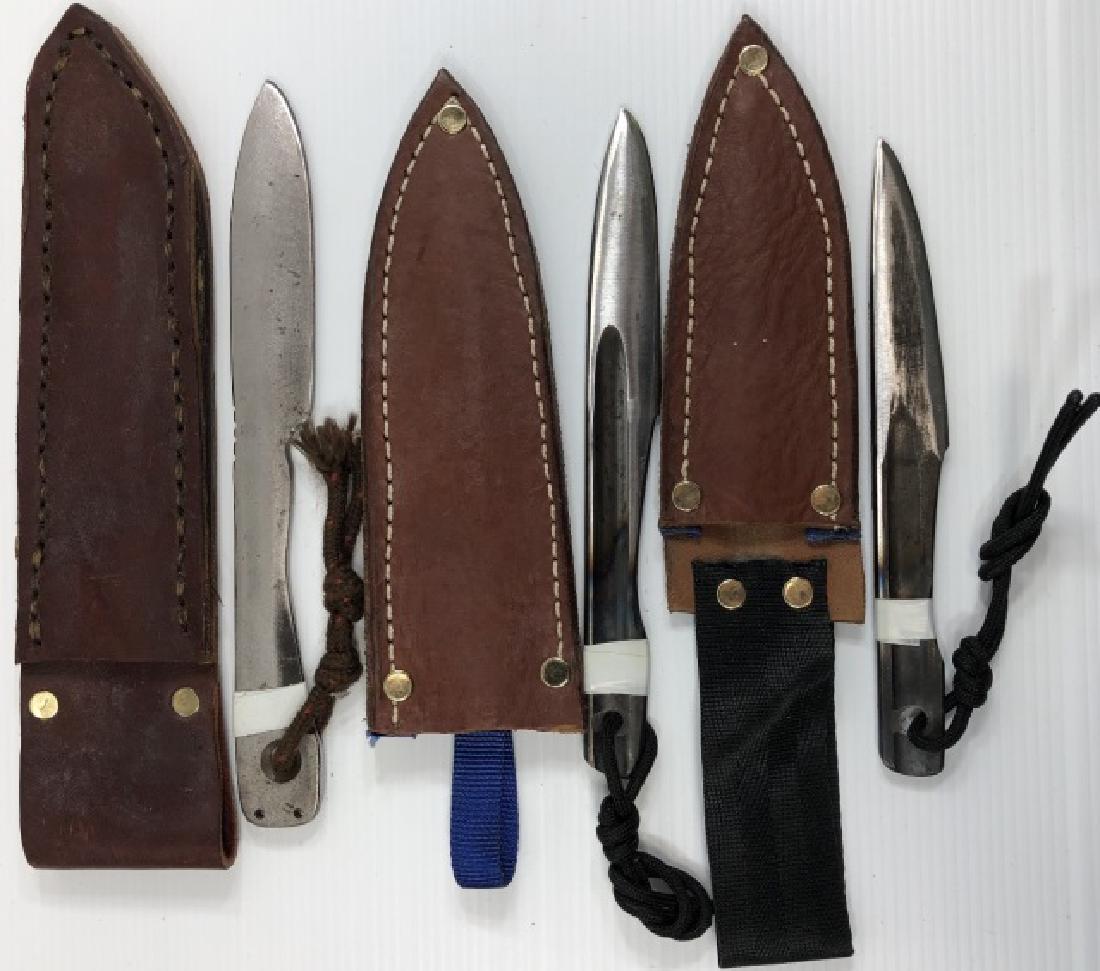 *3 HANDMADE THROWING KNIVES: All with leather sheaths.